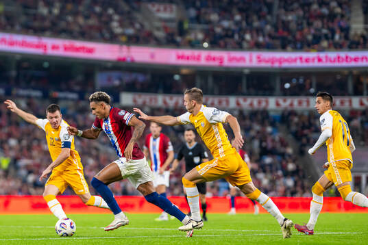 Antonio Nusa of Norway in action against Vadim Rata, Sergiu