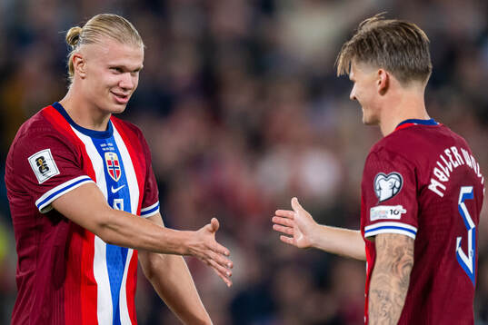 Erling Braut Haaland of Norway celebrates with teammate