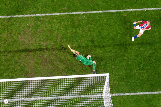 Thelo Aasgaard of Norway scores the 7-0 goal behind