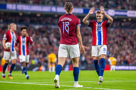 Thelo Aasgaard of Norway celebrates with teammate Martin
