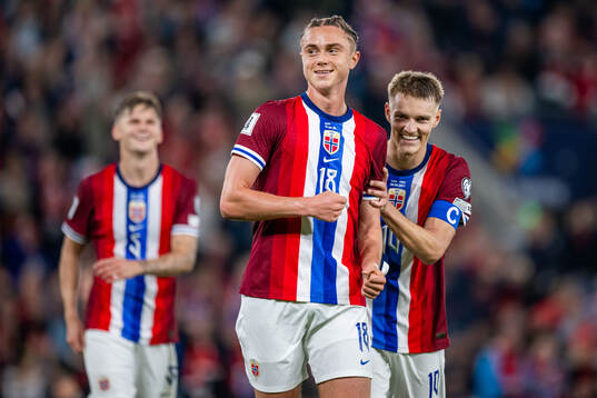 Thelo Aasgaard of Norway celebrates with teammate Martin