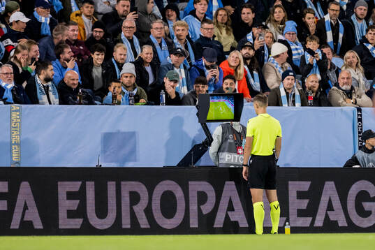 Referee Manfredas Lukjancukas duringa VAR check