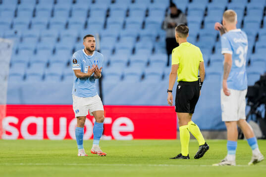 Gabriel Busanello of Malmö FF and referee Manfredas