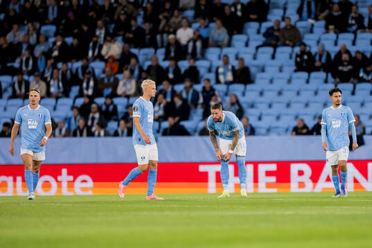 Otto Rosengren and Pontus Jansson of Malmö FF look dejected