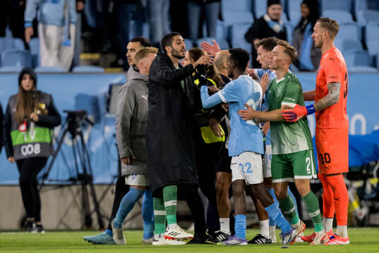 Taha Ali and goalkeeper Robin Olsen of Malmö FF and Joel