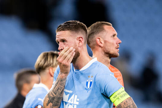 Pontus Jansson and goalkeeper Robin Olsen of Malmö FF