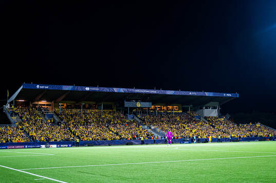 Spectators in the stands at Aspmyra Stadion