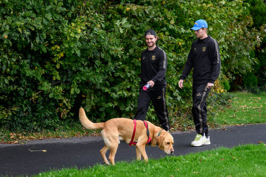 Adam Lundkvist and Simon Gustafson with a dog