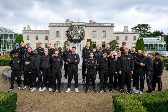 The players pose for a team photo