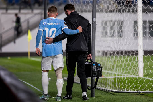 Anders Christiansen of Malmö FF receives medical attention