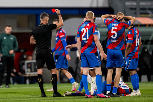 Referee Enea Jorgji calls a red card and Lasse Berg Johnsen