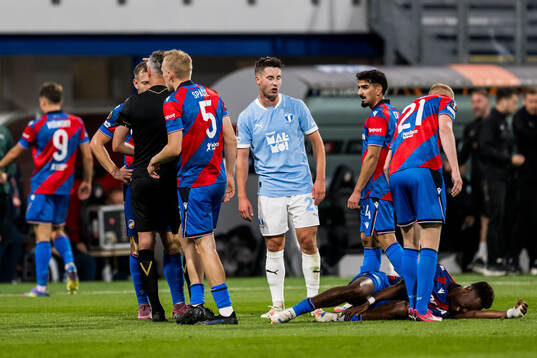Referee Enea Jorgji calls a red card and Lasse Berg Johnsen