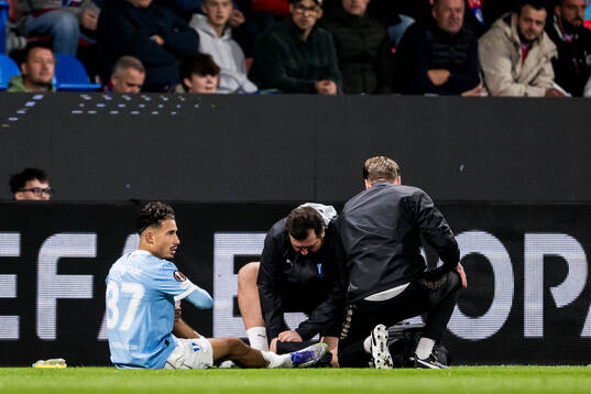 Adrian Skogmar of Malmö FF receives medical attention by