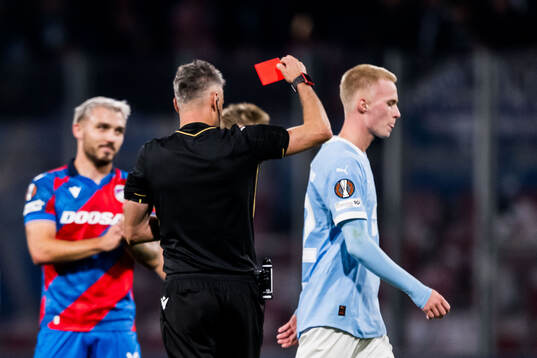 Referee Enea Jorgji calls a red card and Daniel Gudjohnsen
