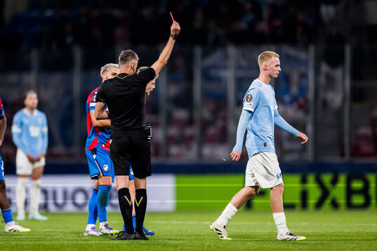 Referee Enea Jorgji calls a red card and Daniel Gudjohnsen