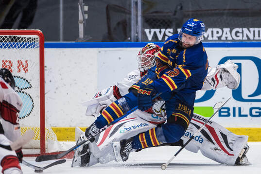 Djurgårdens Marcus Krüger och Malmö Redhawks målvakt