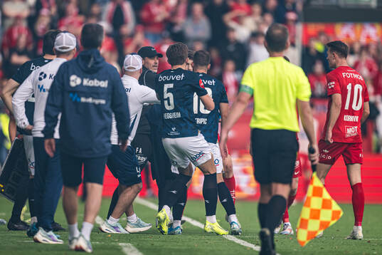 Head coach Freyr Alexandersson of Brann and Zlatko Tripic