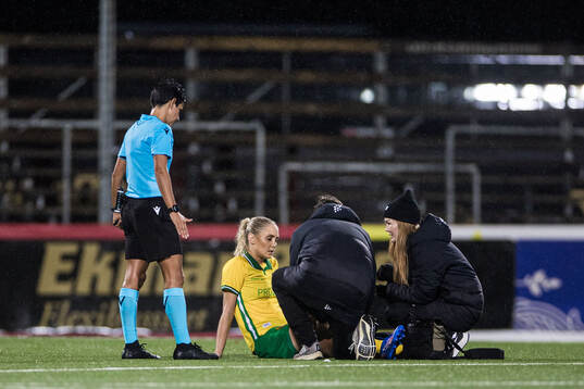 Alice Carlsson of Hammarby receives medical assistance