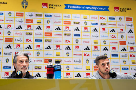 Head coach Murat Yakin and Remo Freuler of Swiss men's