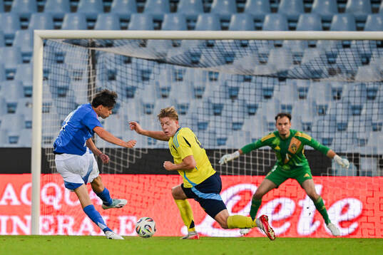 Niccolo Pisilli of Italy scores the 1-0 goal against Nils