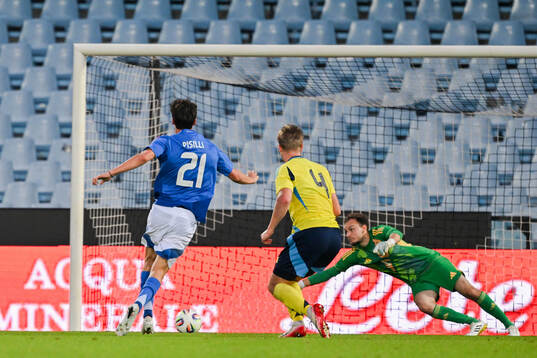 Niccolo Pisilli of Italy scores the 1-0 goal against Nils