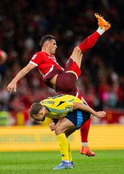 Jesper Karlström of Sweden and Granit Xhaka of Switzerland