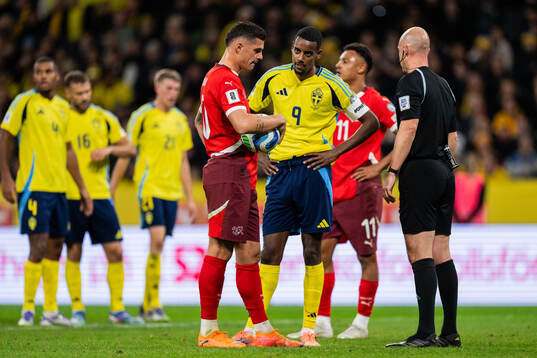 Granit Xhaka of Switzerland and Alexander Isak of Sweden