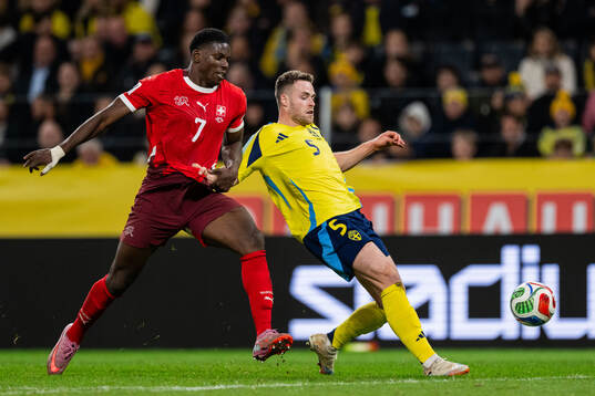 Breel Embolo of Switzerland and Gabriel Gudmundsson of