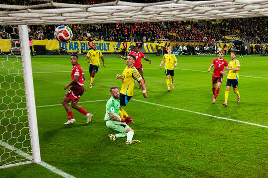 Johan Manzambi of Switzerland scores 0-2 behind goalkeeper
