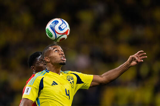Breel Embolo of Switzerland and Isak Hien of Sweden