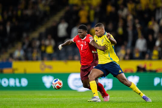 Breel Embolo of Switzerland and Isak Hien of Sweden