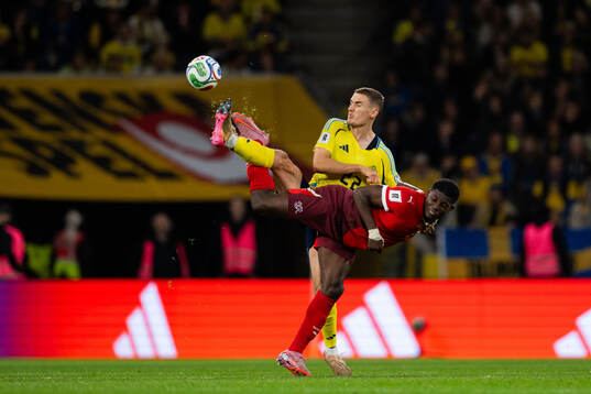 Gustaf Lagerbielke of Sweden and Breel Embolo of Switzerland