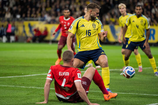 Nico Elvedi of Switzerland and Jesper Karlström of Sweden