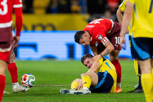 Viktor Gyökeres of Sweden and Granit Xhaka of Switzerland