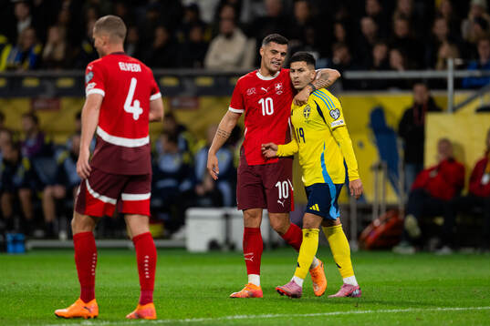 Granit Xhaka of Switzerland and Roony Bardghji of Sweden