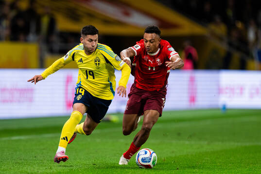 Roony Bardghji of Sweden and Dan Ndoye of Switzerland