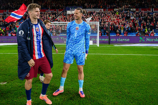 David Møller Wolfe and goalkeeper Ørjan Nyland of Norway