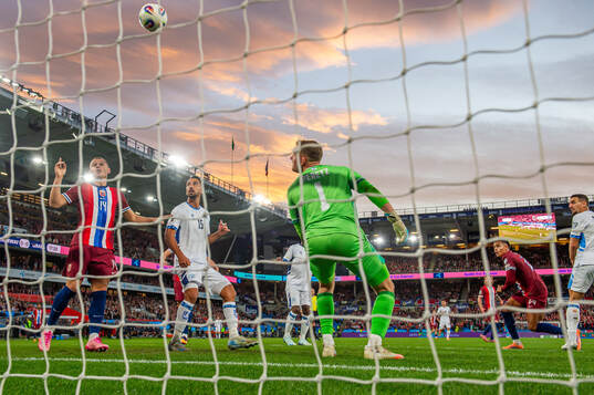 Antonio Nusa of Norway scores the 1-0 goal while Julian