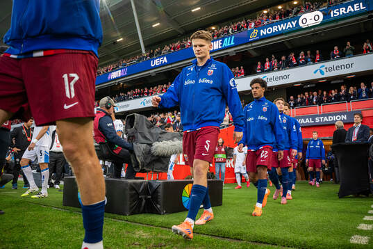 David Møller Wolfe of Norway enters the pitch