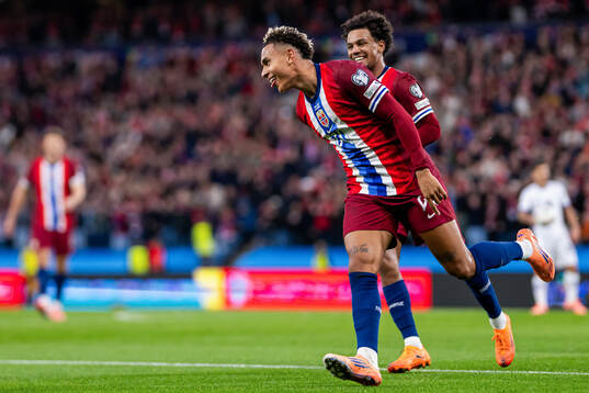 Antonio Nusa of Norway celebrates with teammate Oscar Bobb