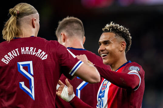 Erling Braut Haaland of Norway celebrates with Antonio Nusa