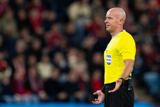 Referee Szymon Marciniak