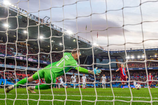 Goalkeeper Daniel Peretz of Israel saves the penalty kick