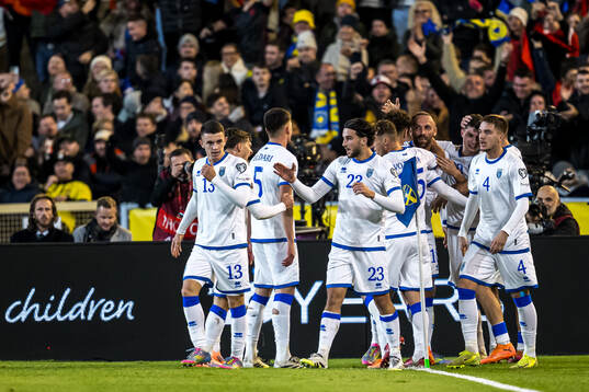 Fisnik Asllani of Kosovo celebrate with teammates the 0-1