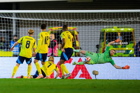 Goalkeeper Viktor Johansson of Sweden with a save