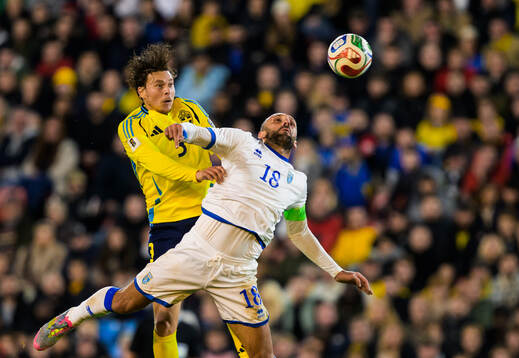 Victor Nilsson Lindelöf of Sweden and Vedat Muriqi of