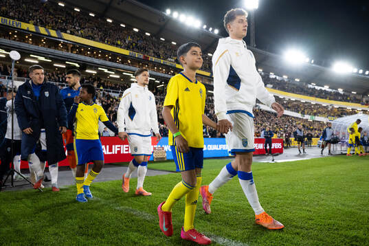 Mascots with players of Kosovo