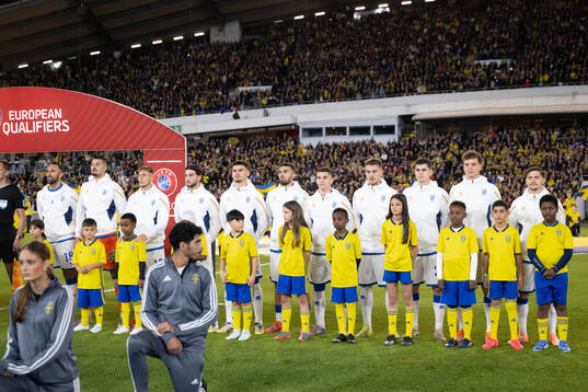 Mascots with players of Kosovo
