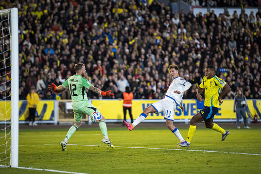 Fisnik Asllani of Kosovo scores the 0-1 goal behind