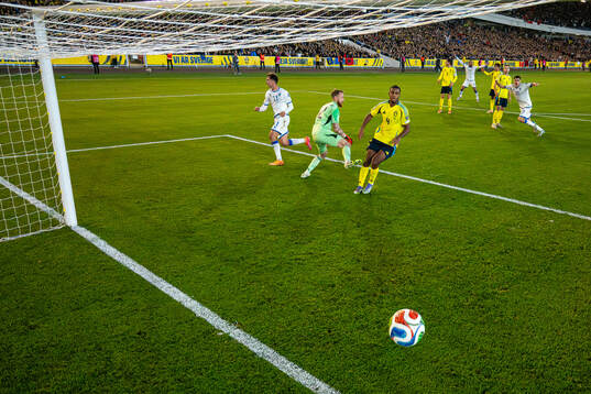 Fisnik Asllani of Kosovo scores 0-1 behind goalkeeper